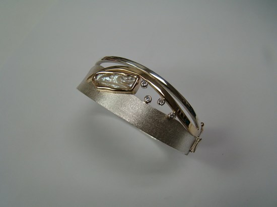 Brushed White Gold Bangle with Mother of Pearl and Bezel Set Diamonds Image