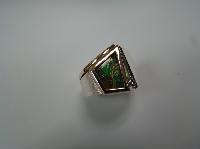 Bezel Set Ammolite in a White and Yellow Gold Band with a Bezel Set Diamond Ring Image